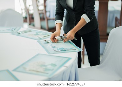 an employee was decorating a table before dinner. - Powered by Shutterstock