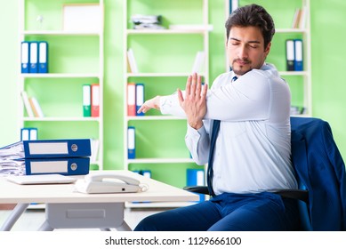 Employee doing exercises during break at work