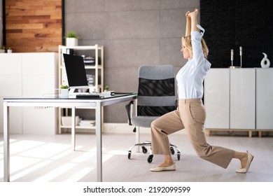 Employee Doing Split Squat Exercise At Desk