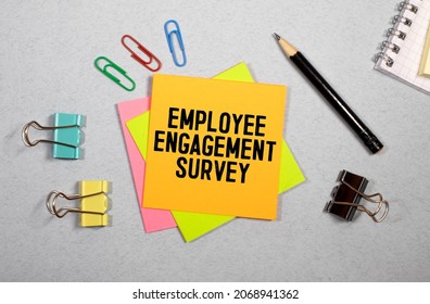 Employee Engagement Survey Sign Written On Sticky Note Pinned On Wooden Wall