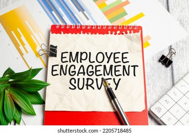 EMPLOYEE ENGAGEMENT SURVEY Text Written On Paper Folder And Charts