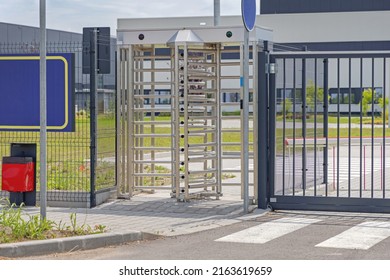 Employee Entrance Turnstile Doors At Factory Gate Fence