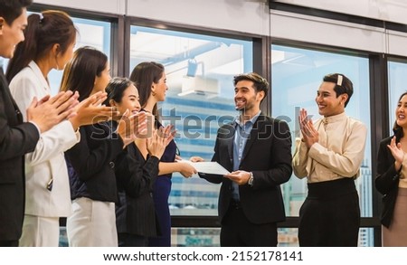 Employee gets a certificate of achievement, Businesspeople with certificate in the office, Businessman giving appreciation certificate to employee for achievement