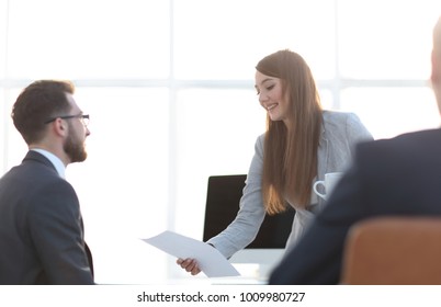 employee gives the Manager the document. - Shutterstock ID 1009980727