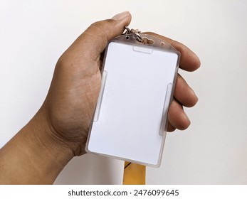 Employee hand showing blank id card badge holder for mockup template logo branding background. - Powered by Shutterstock