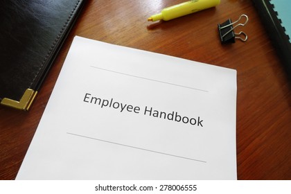 Employee Handbook Document On An Office Desk                               