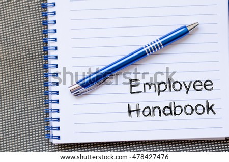 Employee handbook text concept write on notebook