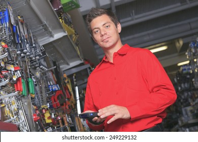 A Employee Of A Hardware Store At Work