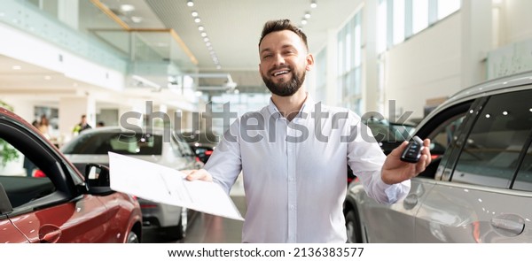 an employee of an\
insurance company draws up an insurance policy when buying a new\
car in a car dealership