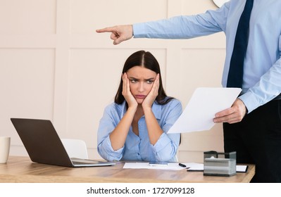 Employee Layoff Dismissal. Boss Firing Woman Worker Showing Employment Agreement Labor Contract Sitting In Modern Office. Cropped