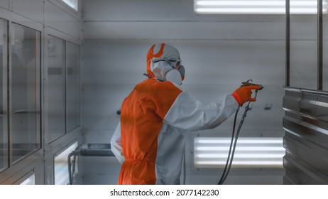 An Employee Of The Paint Shop Of An Automobile Plant Learns To Draw With A Pistol. Training