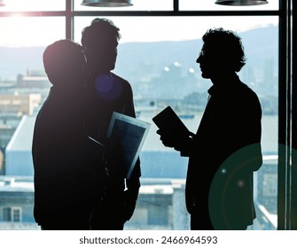 Employee, people and conversation in office on silhouette for strategy, planning and company growth. Group, discussion and window with pride or satisfied as copy writer for partnership and teamwork - Powered by Shutterstock