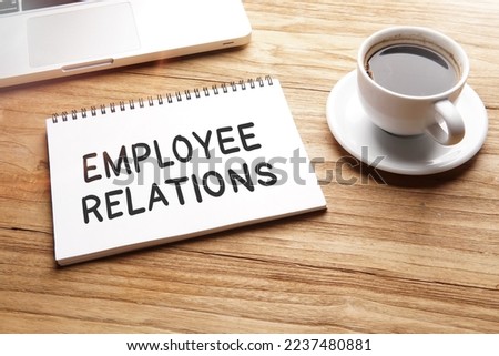 Employee Relations, text words typography written on book against wooden background, life and business motivational inspirational concept