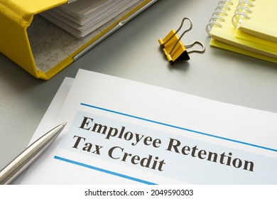 Employee retention tax credit papers and folder. - Shutterstock ID 2049590303