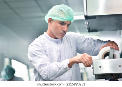 Employee Setting Machine Work In Food Factory