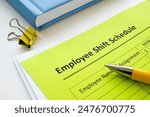 Employee shift schedule form and pen.