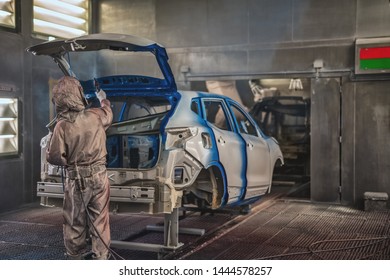 Employee In The Shop Painting The Car Body Produces A Painting Of The Interior Elements Of The Car