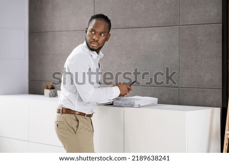 Employee Stealing Documents In Office Using Phone. Secret Theft