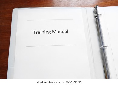 Employee Training Manual On A Desk                               