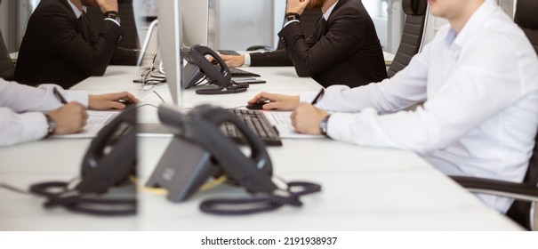 Employees Of The Company At Work In The Office. Workplace And Everyday Moments And Responsibilities. Phone Calls, Customer Interaction And Computer Work