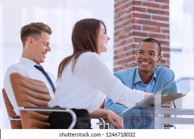 employees discussing new ideas in the workplace - Shutterstock ID 1246718032