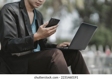 Employees fired or resigned from the company are using their mobile phones to find a jobs and schedule an interview.Unemployed, hiring job, quitting job concept. - Shutterstock ID 2231460191