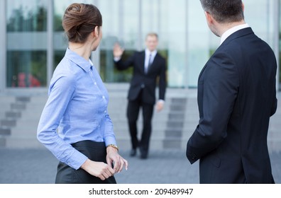 Employees Talking In Front Of Business Centre, Horizontal