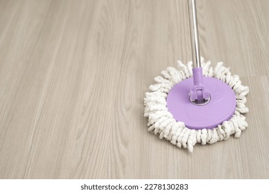 Employees use mop cloths to clean the floor inside the house. - Shutterstock ID 2278130283