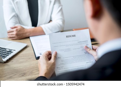 Employer arriving for a job interview, businessman listen to candidate answers explaining about his profile and colloquy dream job, manager sitting in job Interview talking in office.