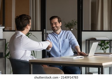 Employer, boss hiring candidate after successful job interview. Happy customer and lawyer, finishing consultation, meeting, shaking hands. Happy business men giving handshakes after negotiations