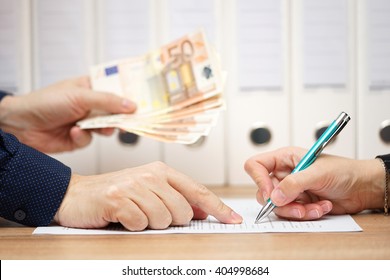 employer or businessman showing where to sign  in exchange to give money or severance