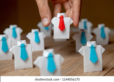 Employer chooses takes in hand employee. Leader stands out from crowd. Looking for good worker. HR, HRM, HRD concepts - Shutterstock ID 1144056170