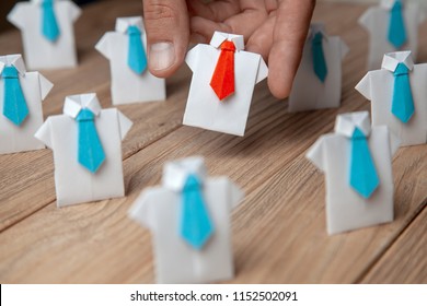 Employer chooses takes in hand employee. Leader stands out from crowd. Looking for good worker. HR, HRM, HRD concepts - Shutterstock ID 1152502091