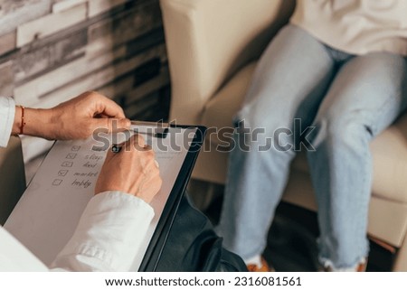 Employer or recruiter holding reading a resume during about colloquy his profile of candidate. Close up interviewer interview candidate apply for job in office. Employer is conducting a job interview
