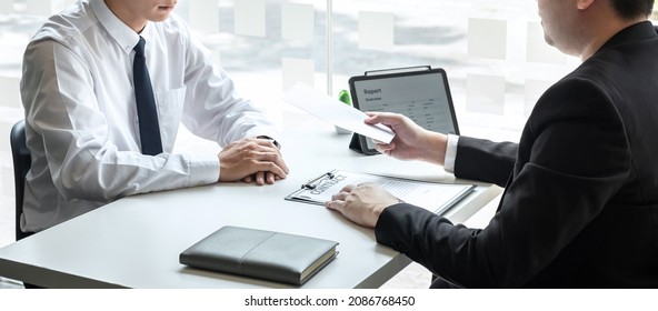 Employer sending resignation letter to employee consider in order to contract for quit or layoff of job leaving from work, resignation concept. - Shutterstock ID 2086768450