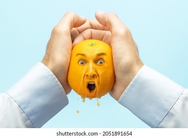 The employer squeezes all the strength or juice out of the employee. Coming up with ideas, squeezing creativity out of yourself. Hands pour out juice from an orange, an orange with a face.