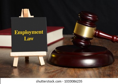 Employment Law Sign With Gavel And Red Book