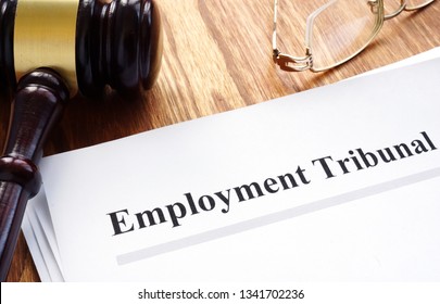 Employment Tribunal Documents With Pen On Table.