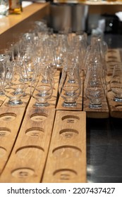 Emply Whisky Glasses Served In Flights On Wooden Boards In Whiskey Bar In Edinburgh, UK