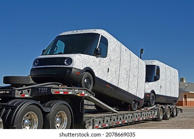 Emporia, Kansas, November 21, 2021
Two brand new model EDV 500 Rivian Electric Delivery Vans (EDV) part of the fleet order for Amazon on the back of a transportation truck way on their way thru Kansas
