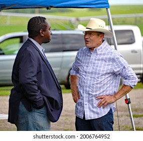 Emporia Kansas, USA, July 11, 2021
L-R Michael Austin Candidate For Kansas State Treasurer Talks With Lynn McAllister Candidate For The Lyon County School Board At The Lyon County Republican Picnic 