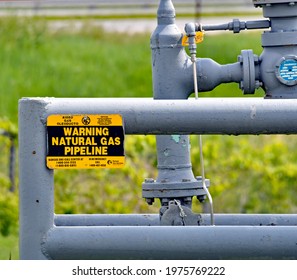 Emporia Kansas, USA, May 12, 2021
Natural Gas Pipeline Crossing Warning Signs Indicating Where Underground Pipelines Are Located 