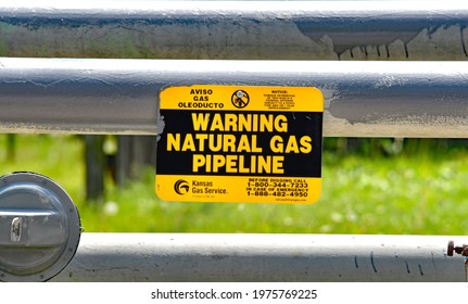 Emporia Kansas, USA, May 12, 2021
Natural Gas Pipeline Crossing Warning Signs Indicating Where Underground Pipelines Are Located 