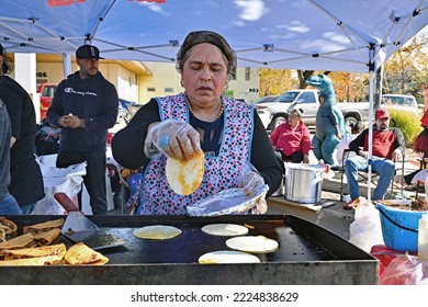 EMPORIA, KANSAS, USA - OCTOBER 29, 2022
Local Latino Women Preparing Traditional Cultural Food Items During The Dia De Los Muertos Celebration 