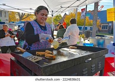 EMPORIA, KANSAS, USA - OCTOBER 29, 2022
Local Latino Women Preparing Traditional Cultural Food Items During The Dia De Los Muertos Celebration 