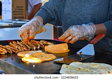 EMPORIA, KANSAS, USA - OCTOBER 29, 2022
Local Latino Women Preparing Traditional Cultural Food Items During The Dia De Los Muertos Celebration 