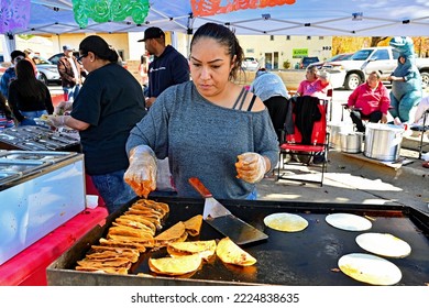 EMPORIA, KANSAS, USA - OCTOBER 29, 2022
Local Latino Women Preparing Traditional Cultural Food Items During The Dia De Los Muertos Celebration 