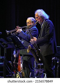 EMPORIA, KANSAS, USA - OCTOBER 9. 2021
Saxophonist Blue Lou Marini (of The Blues Brothers Movie ) In A Duet With Trumpeter Art Davis During A Jazz  Concert In The Historic Emporia Granada Theatre