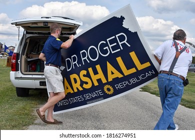 Emporia Kansas, USA, September 16, 2020 
Local Republican Supporters Unload Dr. Roger Marshall Senate Candidate Large Yard Signs At The Lyon County Fairgrounds.