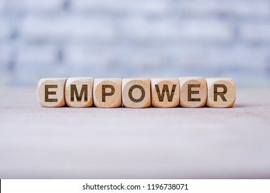 Empower Word Written On Wood Block